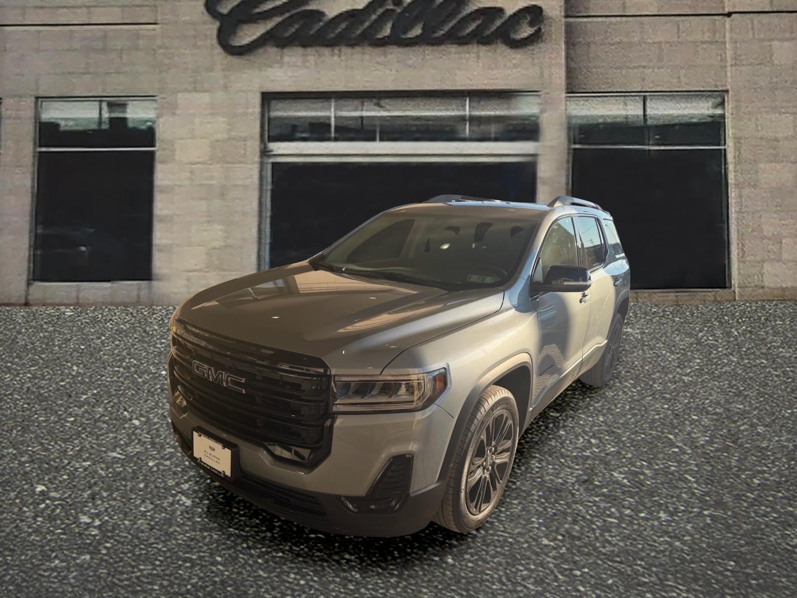 2023 GMC Acadia SLE in Sterling Metallic — front three-quarter view